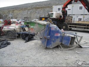 A tipped blue skip. BAM Nuttall has been fined after a young worker was crushed to death by it.