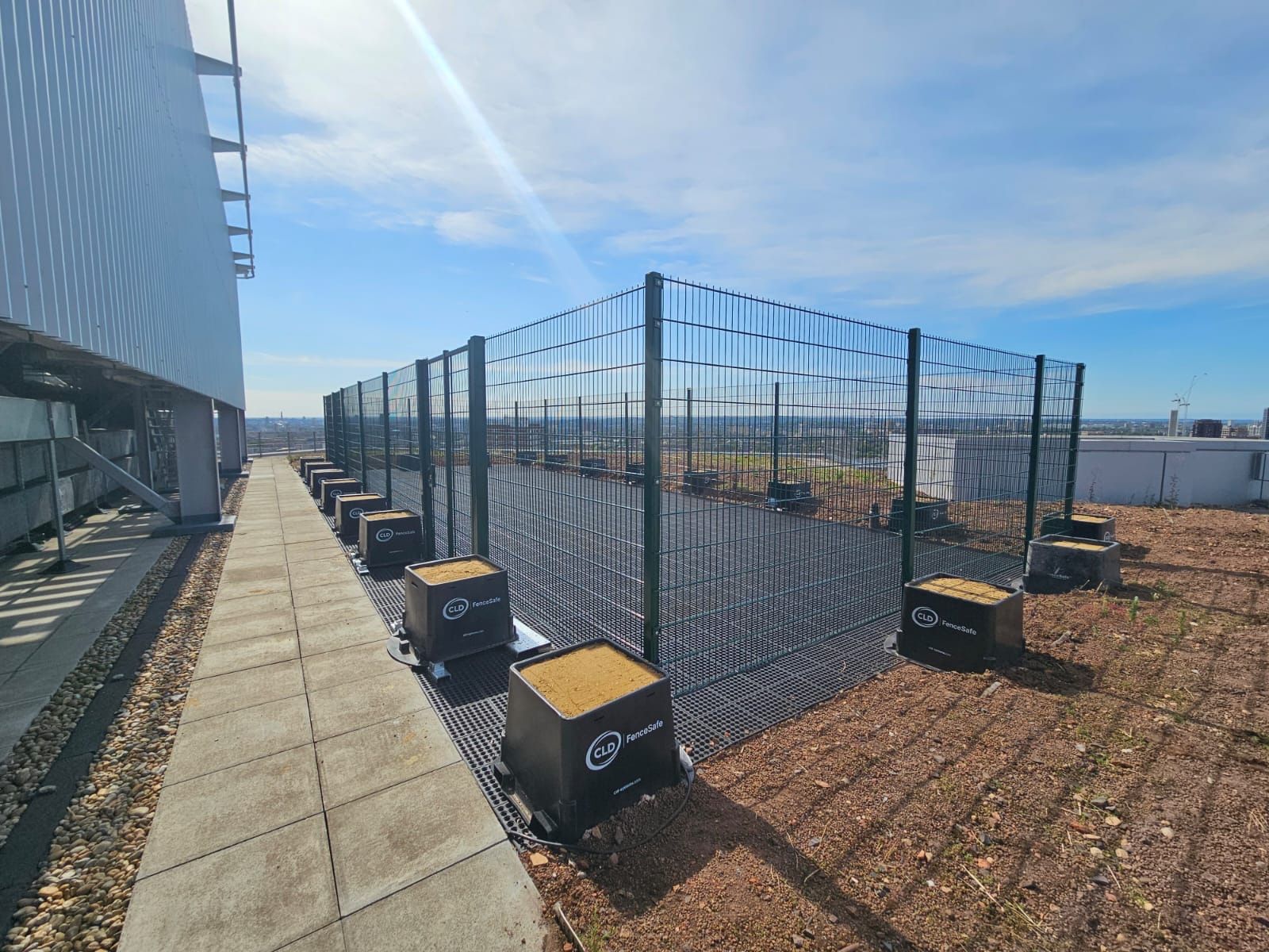 The drone landing area made of rubber. There's a fence surrounding it - a contractor has installed a drone landing area at a major NHS hospital.