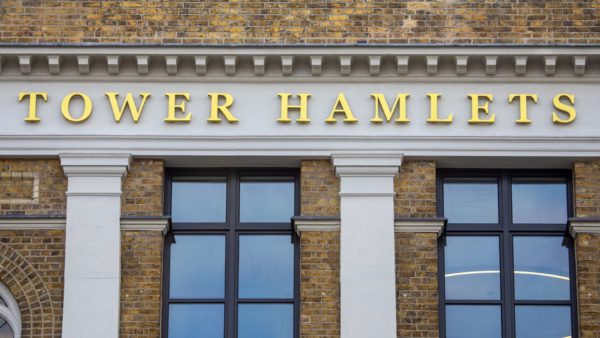 Letters saying 'Tower Hamlets' on the exterior of Tower Hamlets Town Hall in east London. The council has secured its first remediation order against a building owner.