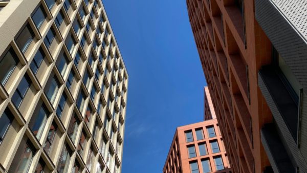 View from the ground of three modern high-rise residential buildings - in this article, John Forde explains how to deal with delays in the Gateways process.