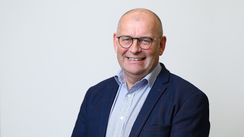 Mugshot of Lindsay McGibbon smiling at the camera - former Balfour Beatty colleagues have set up a charity fundraiser in his memory.