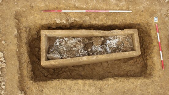 The Roman stone coffin under excavation - a huge Roman coffin has been unearthed during A47 upgrade works