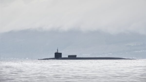 Silhoutte of a submarine in the sea - Rolls-Royce has appointed Mott MacDonald and AtkinsRéalis to design the expansion of its submarine facilities in Derby.