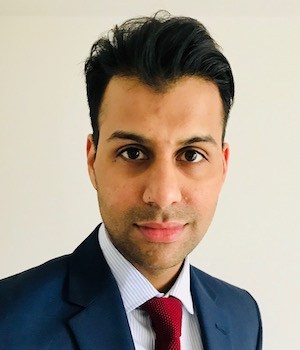 Mugshot of a man smiling at the camera. Aman Sharma has been recognised at the New Year Honours List 2025 for his work on building and fire safety.