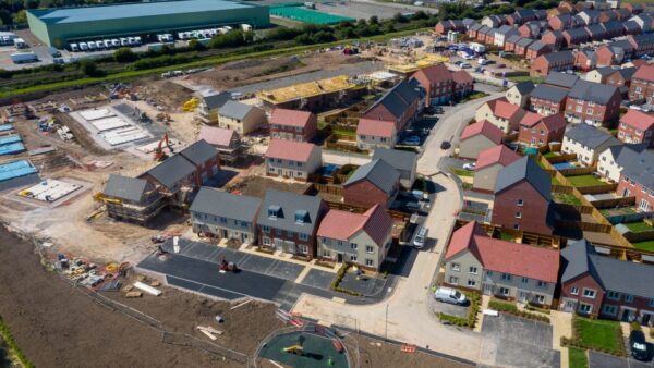 Aerial view of new houses being built - the House of Lords has launched a modular inquiry into the practicalities of the new towns plan