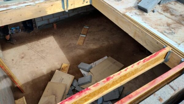The collapsed stairwell after the incident, with concrete blocks at the bottom - Taylor Wimpey has been fined £800,000 after an apprentice was injured on site