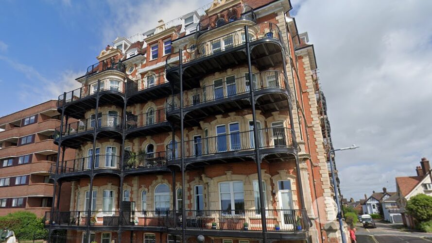 Front of a period luxury block of apartments against a blue sky. The developer and its director have been sentenced following serious fire safety failings.