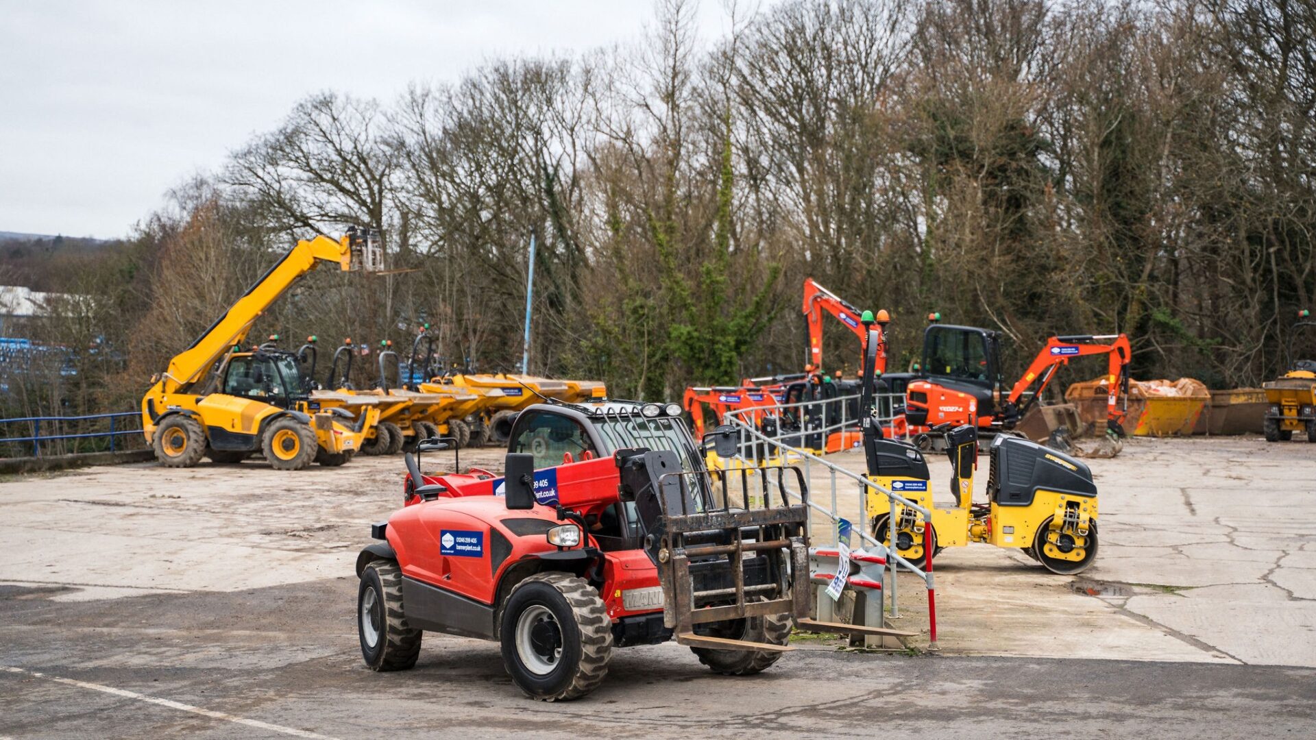 A piece of red plant machinery with other equipment on the background - Henry Boot to expand use of lower-carbon HVO fuel following successful Banner Plant trial 