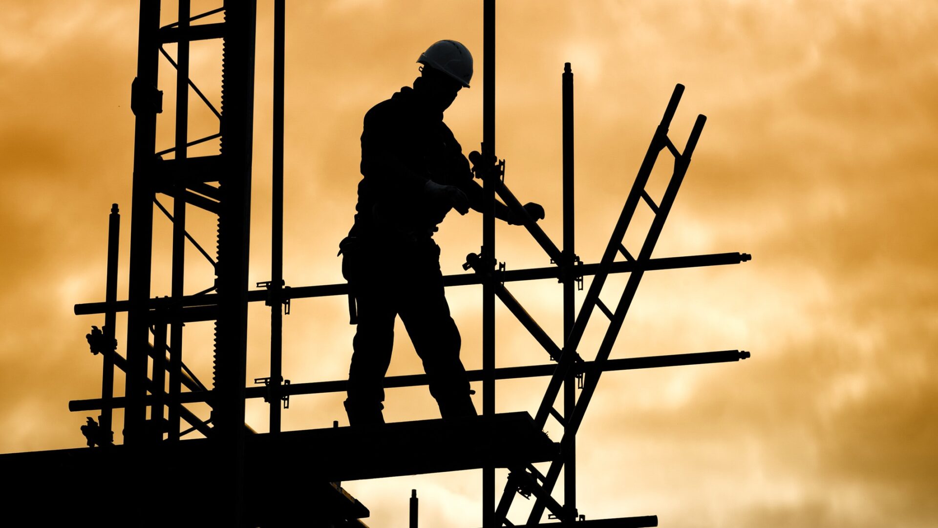 Silhouette construction worker on scaffolding building site - the CLC has launched a consultation on mental health in the industry