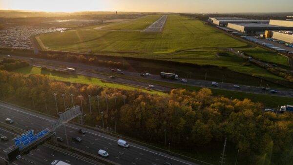 Aerial view of an airport surrounded by fields and highways - Costain has been selected to conduct two biodiversity studies for Manchester Airports Group