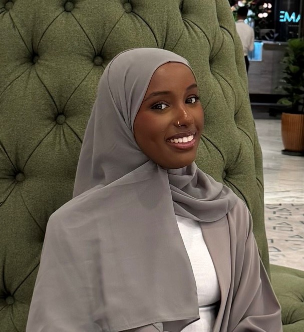 Mugshot of a woman smiling at the camera