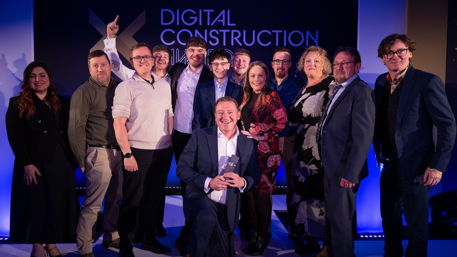 The Drone Surveying team collect their trophy from Ed Byrne (far right) and Hadeel Saadoon of the Connected Places Catapult (far left). Image: © 2026 – ASV Photography Ltd. www.ASVphotos.com.