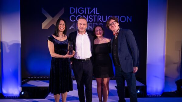 Harmony Fire collect their trophy from Ed Byrne (far right) and Karolina Orecchini of Digital Construction Week. Image: © 2026 – ASV Photography Ltd. www.ASVphotos.com