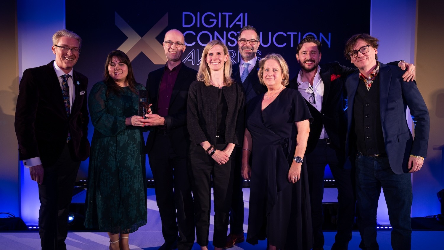 Dr Melanie Robinson received the trophy on behalf of Dr Anne Kemp OBE from Ed Byrne (right) and Justin Stanton of DC+ (left). Image: © 2026 – ASV Photography Ltd. www.ASVphotos.com
