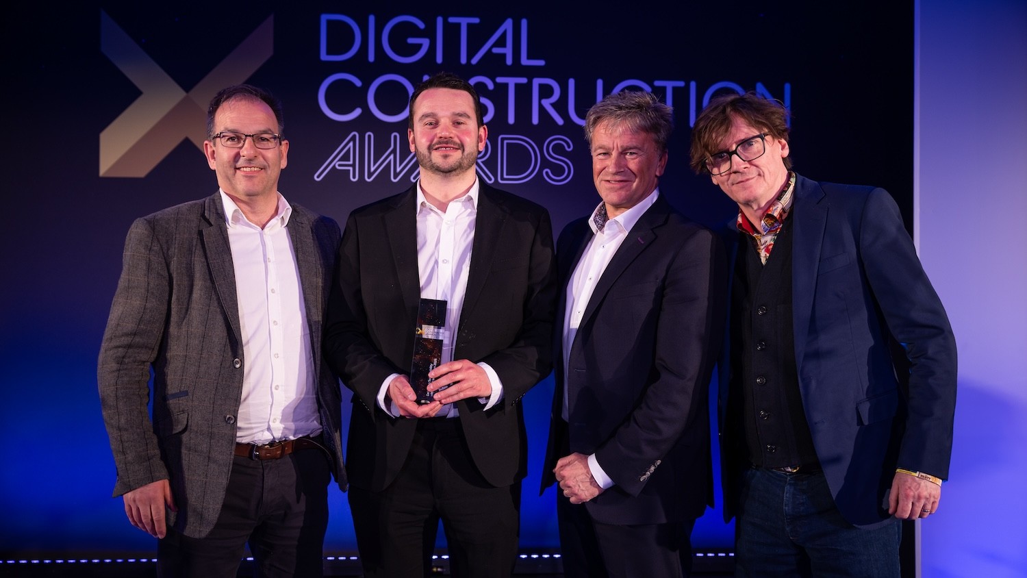 Cardiff Metropolitan University collect their trophy from Ed Byrne (far right) and Saul Humphrey of the CIOB (second right). Image: © 2026 – ASV Photography Ltd. www.ASVphotos.com