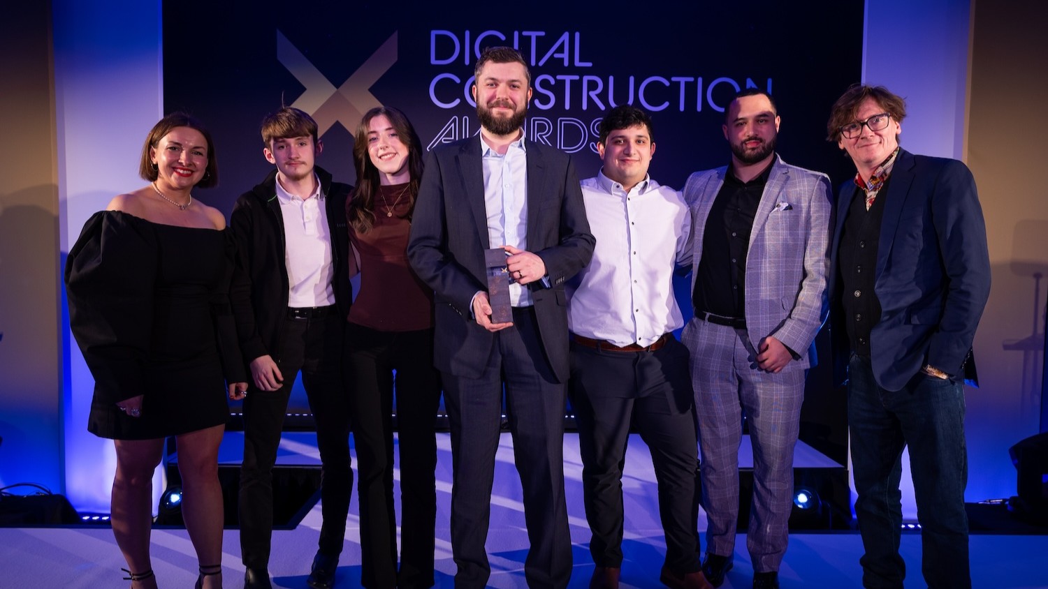 AtkinsRéalis collect their trophy from Ed Byrne (far right), Jordan Smith from Digital Construction North (second right) and Karolina Orecchini from Digital Construction Week (far left). Image: © 2026 – ASV Photography Ltd. www.ASVphotos.com
