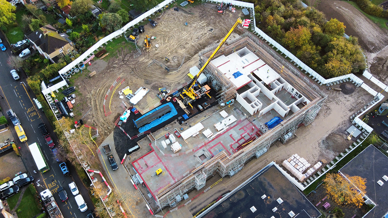Drone shot of construction progress showing the closed-panel composite timber frame system. Image: Morgan Sindall
