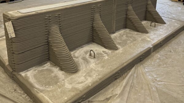 The bases are up to 10 times stronger than traditional precast elements despite being up to 60% lighter thanks to a thin, reinforced base design. Image: Hyperion Robotics.