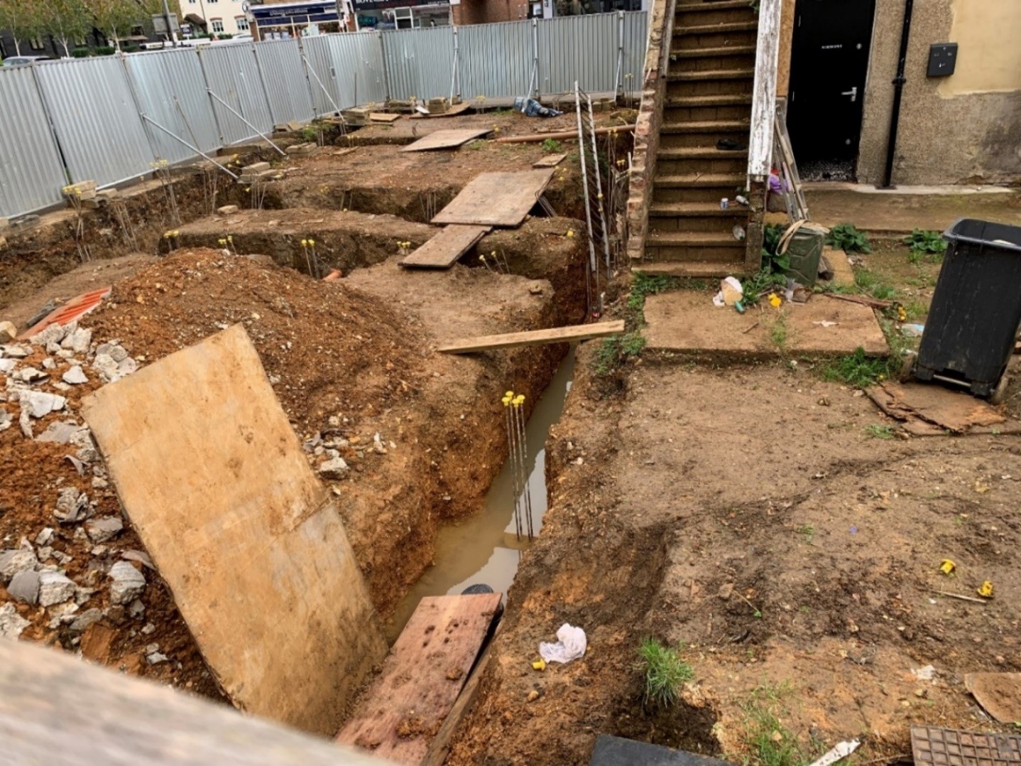 worker drowned on site - A construction company has been fined after a man drowned when he fell into an exposed excavation at night