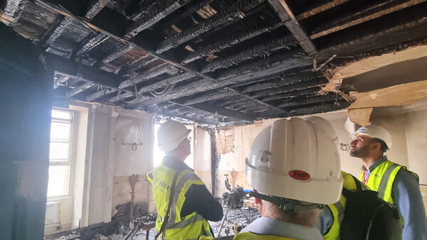 Inspecting the aftermath of the fire. Image: MSMR Architects