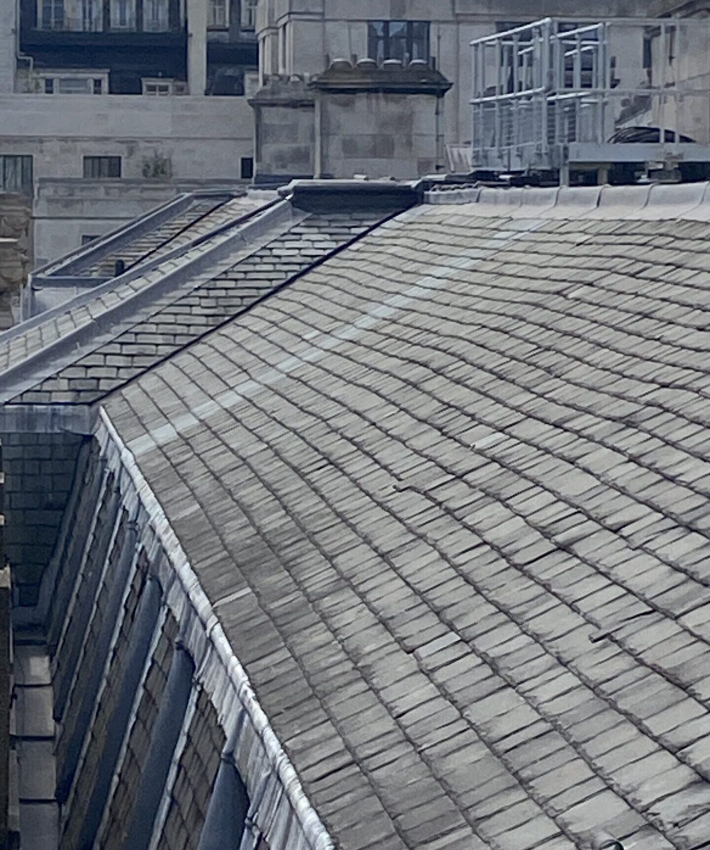 The repaired roof of the south wing. The lighter-coloured tiles show the spot where the London Fire Brigade cut through to create the fire break. Image: Atom